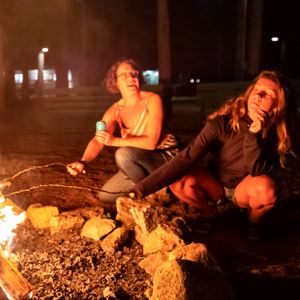 Women by a campfire