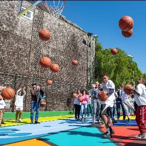 People with basketballs on Hayes Valley Court