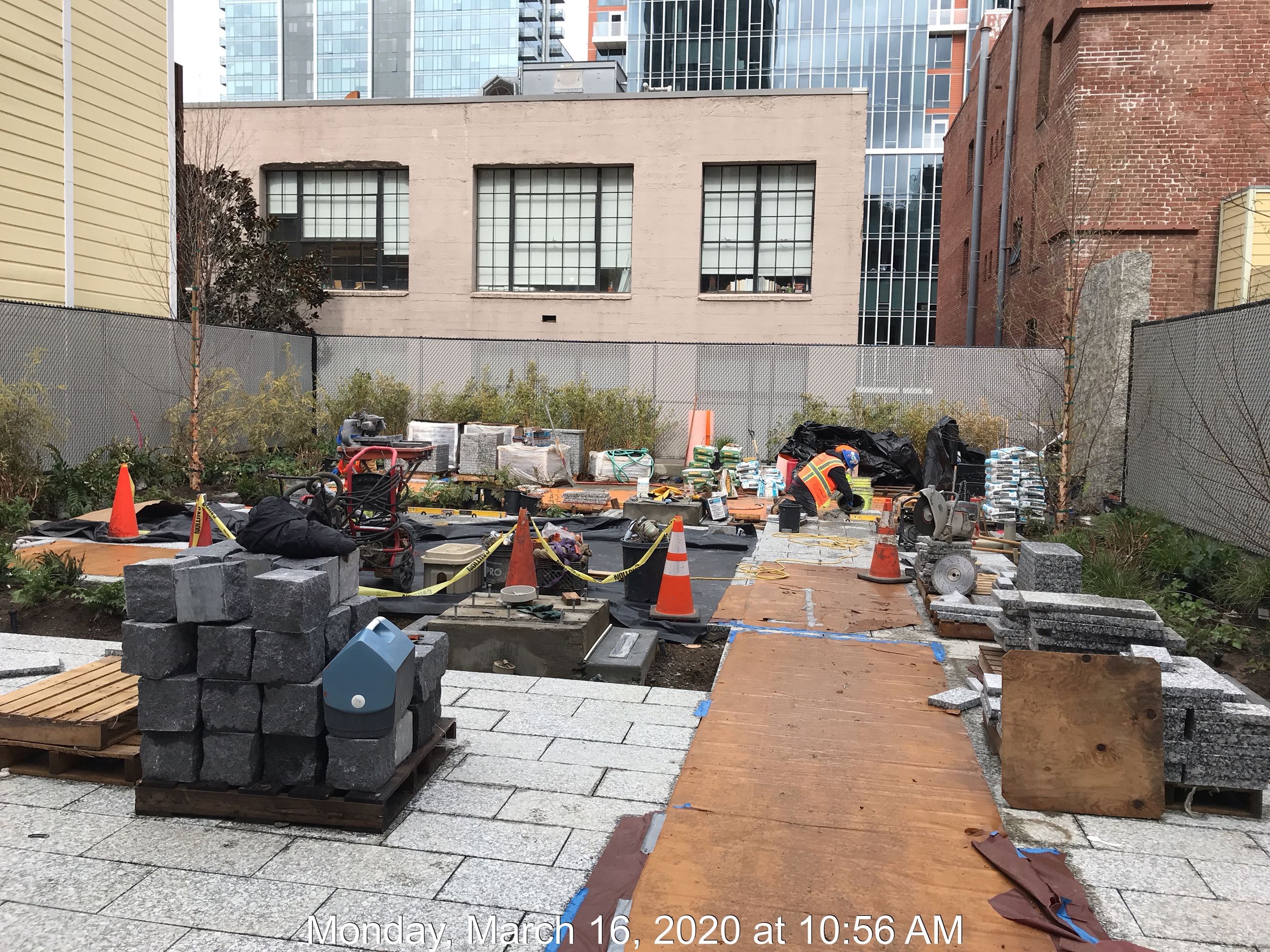 Guy Place view of the stone blocks stacked and being placed onsite