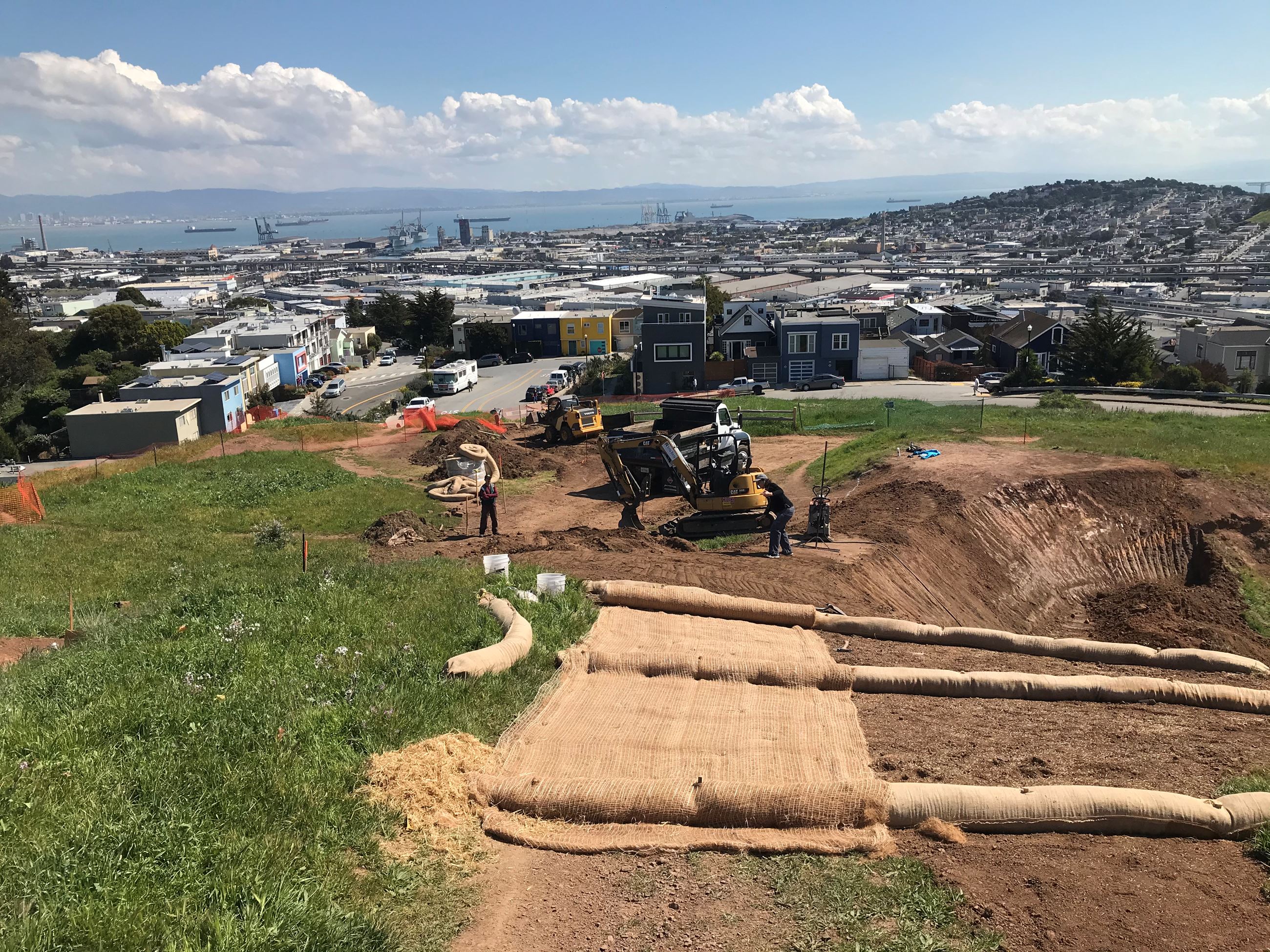 View of Bernal Heights Trail construction showing erosion control measures in the foreground and con