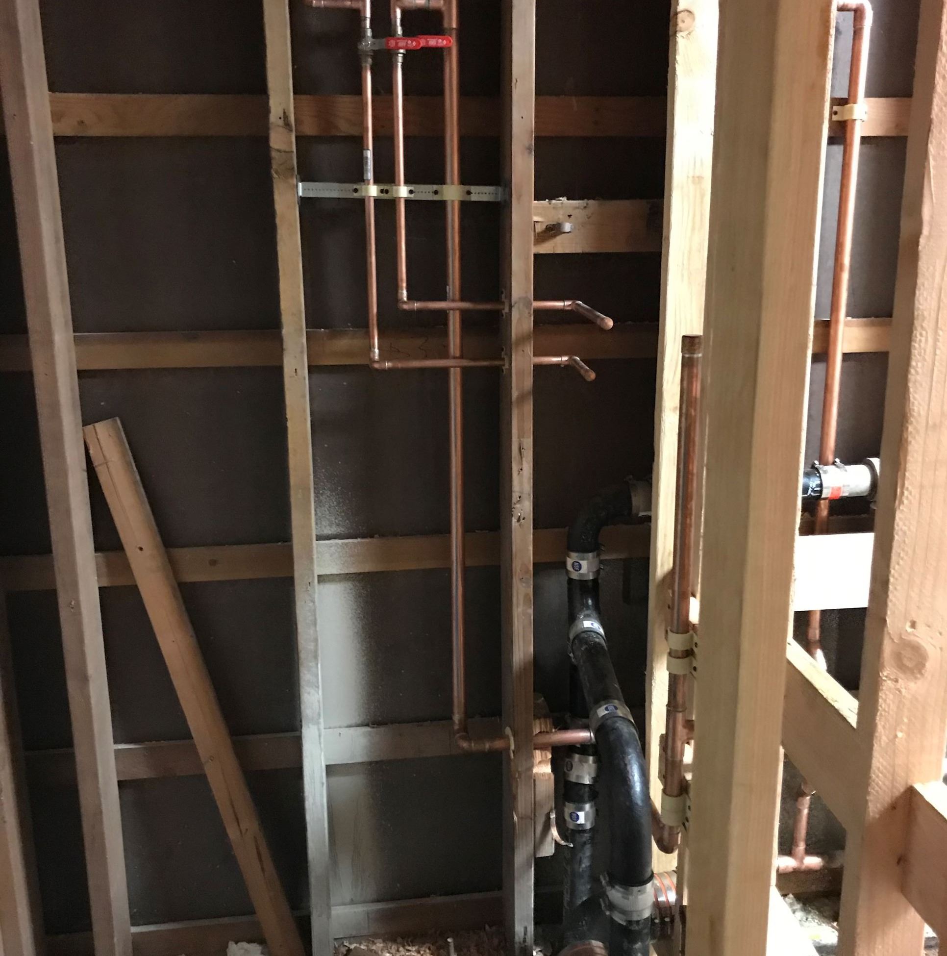 Image shows the South Wall of the custodial closet in construction, this photo is showing the mop si