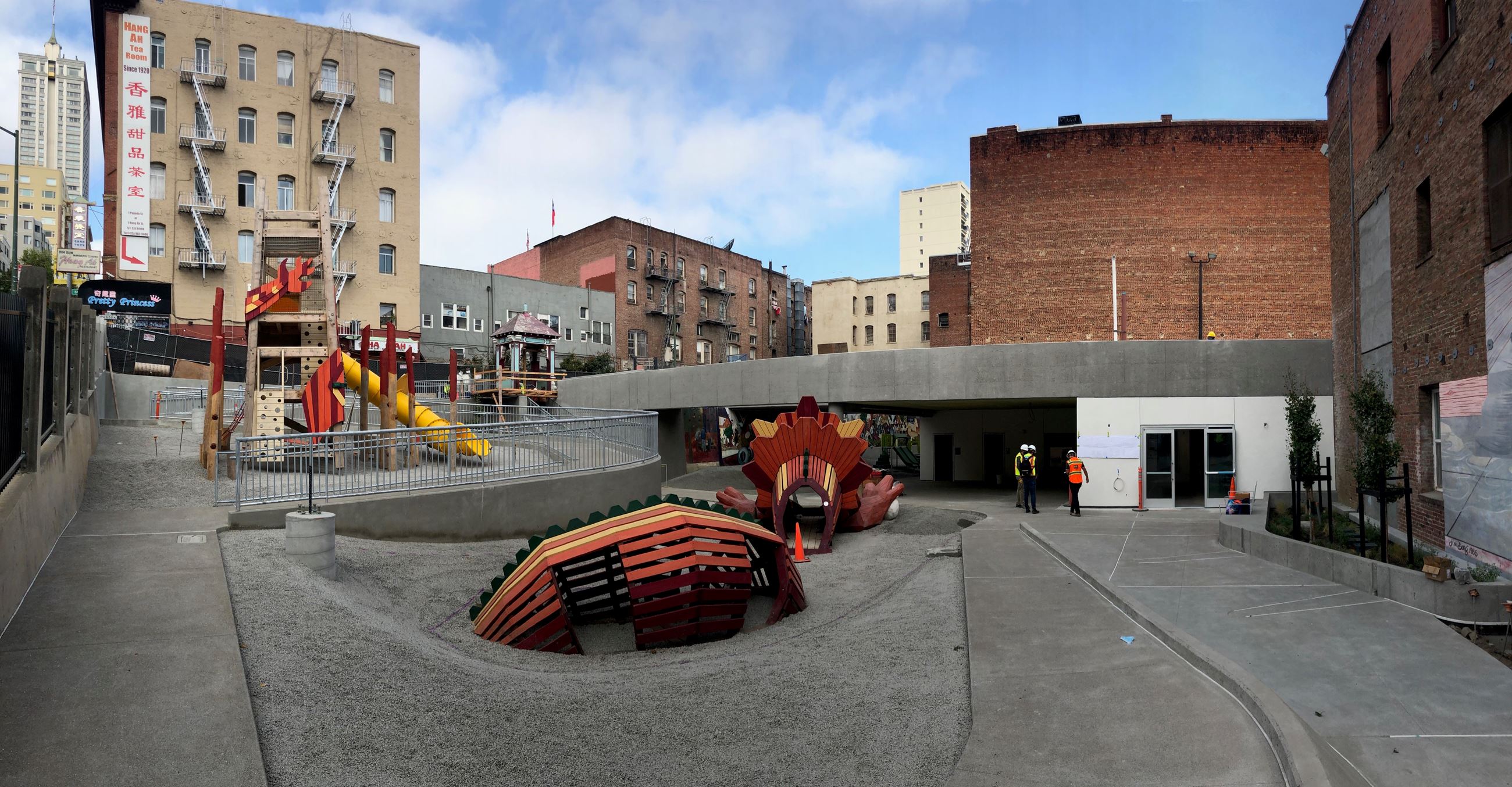 View from the entrance facing inside the park, large orange structure on the left and forward