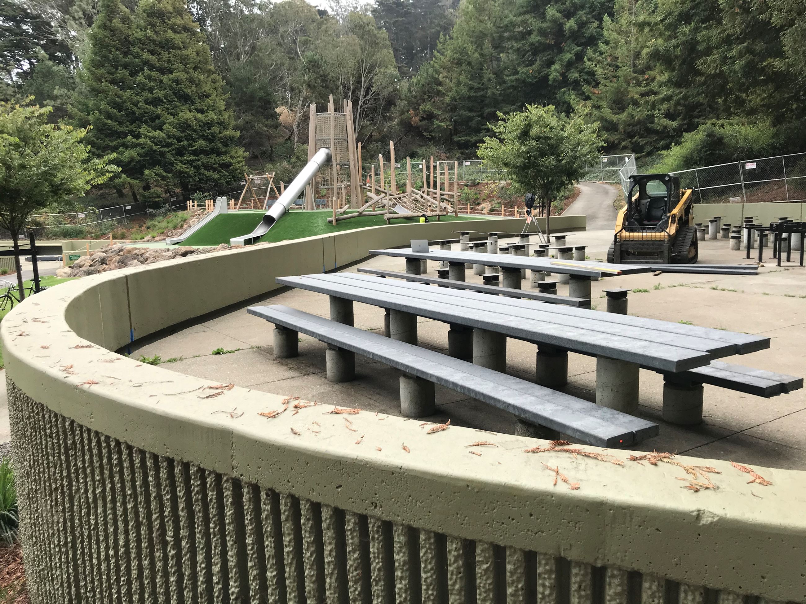 New picnic tables, seat wall and playground