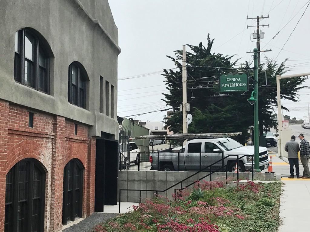 Geneva Powerhouse exterior red brick, cement, and windows with black trim