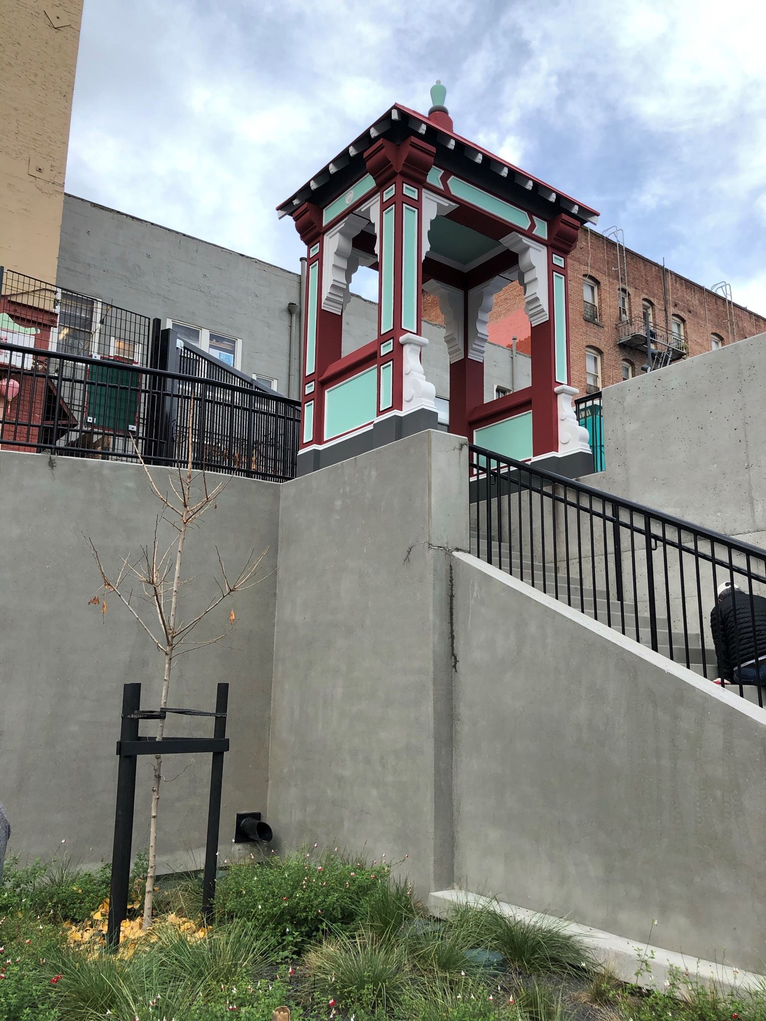 Pagoda at the top of the cement staircase and a new tree planted