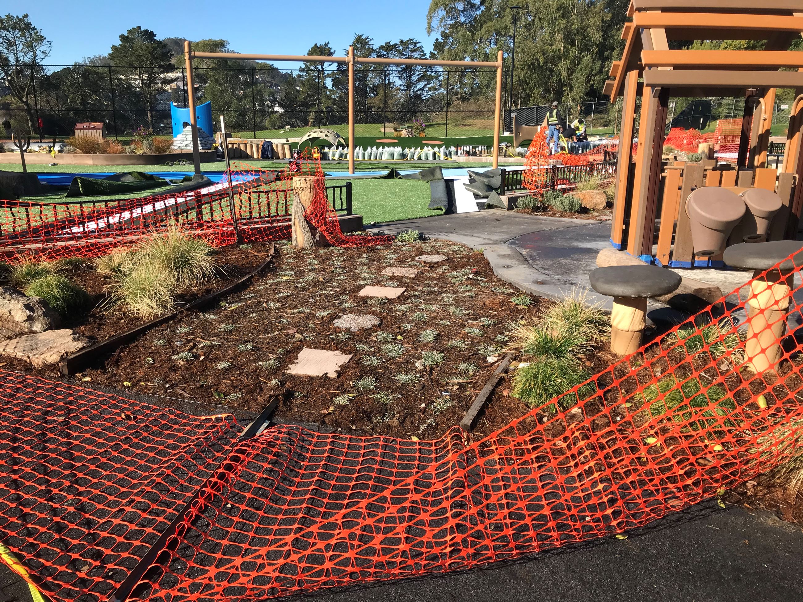 Looking Towards Sculptures view of play structure on the right and green surfacing