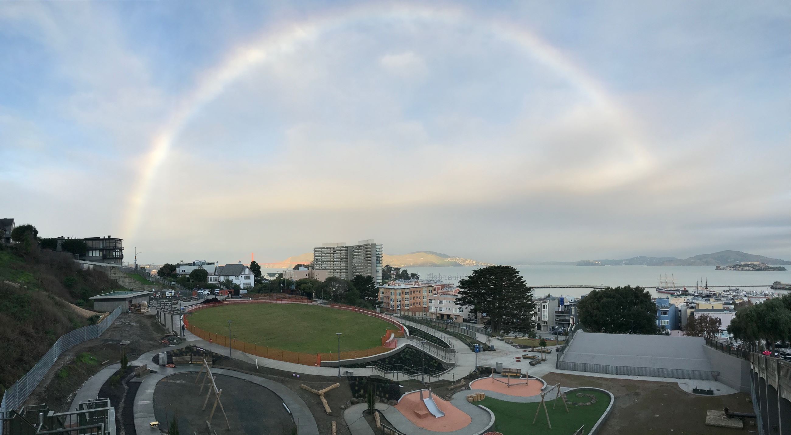View of Francisco Park under construction with a rainbow over it