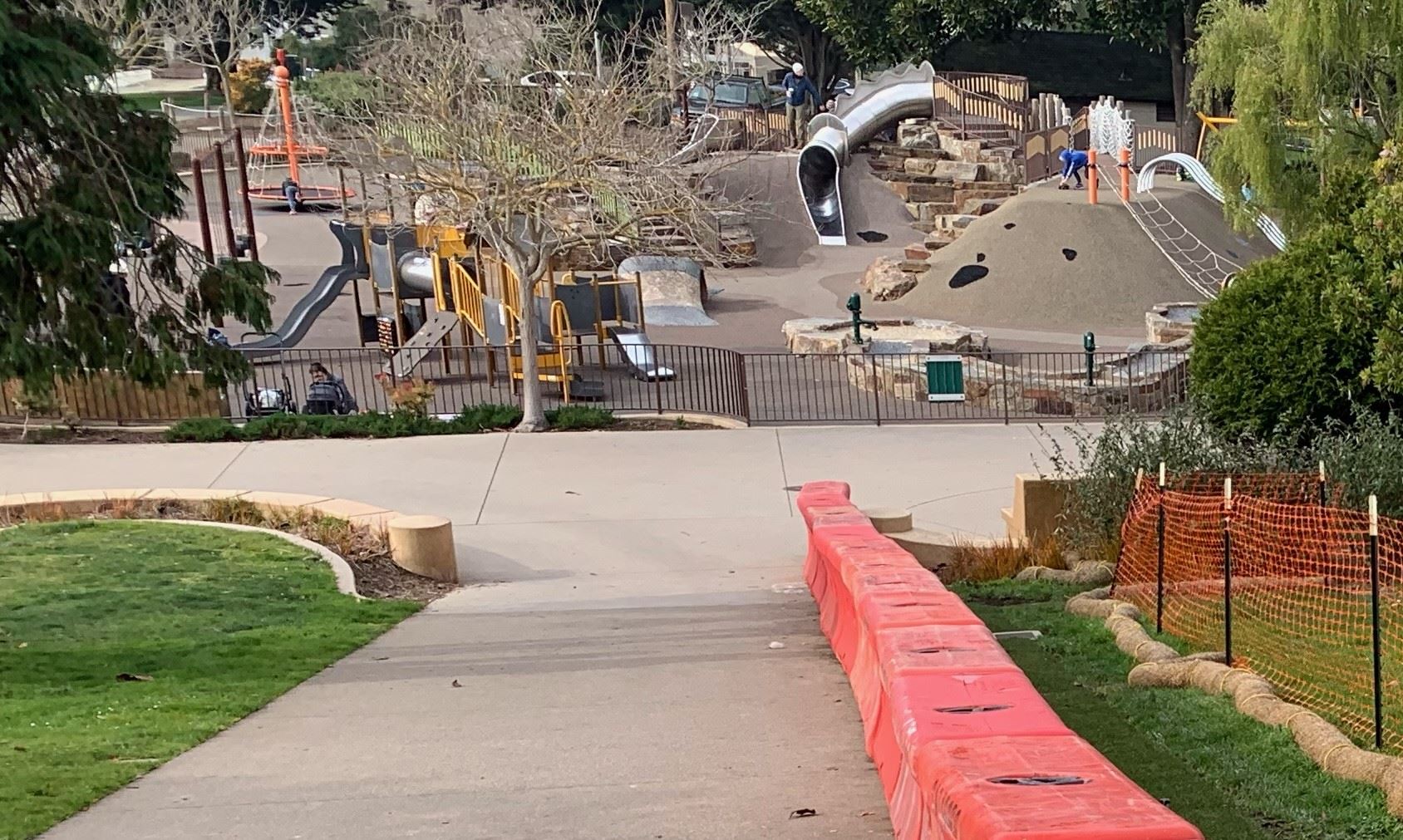 Pathway shown in between two orange barriers