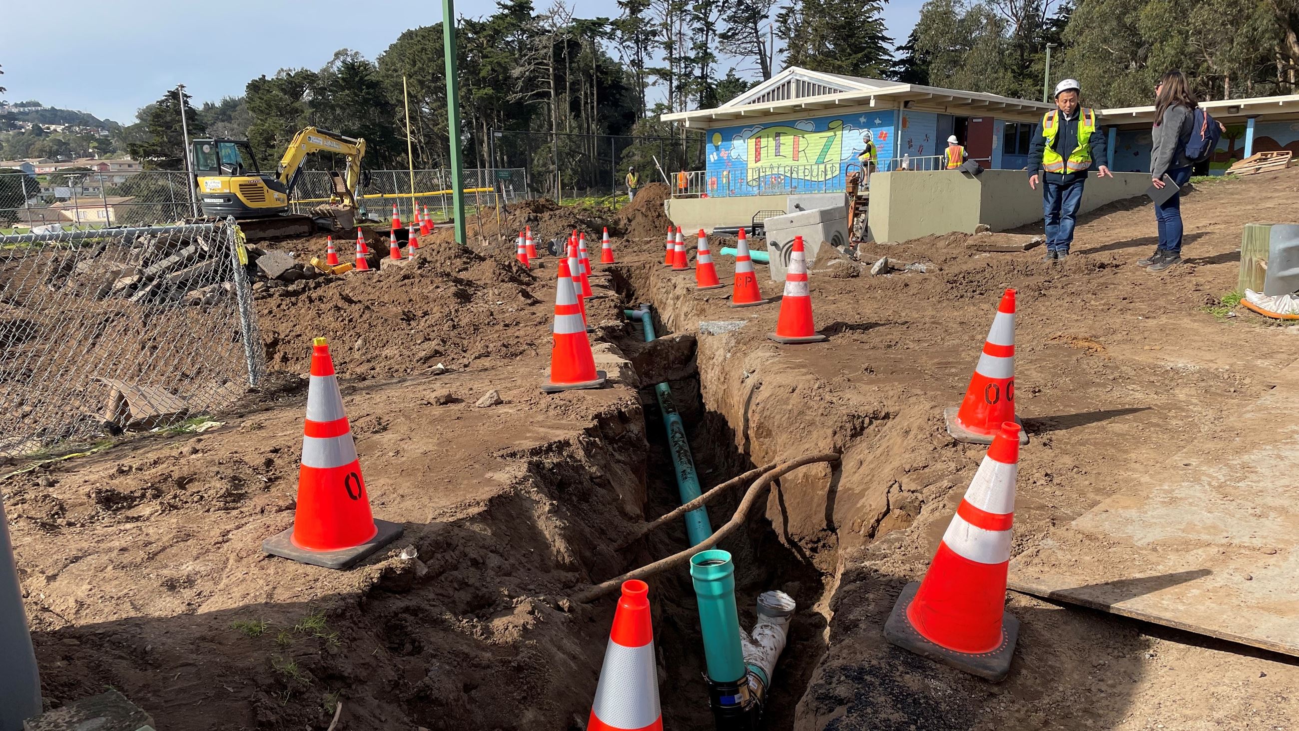 Photo of pipe inside a trench at Herz Playground construction site