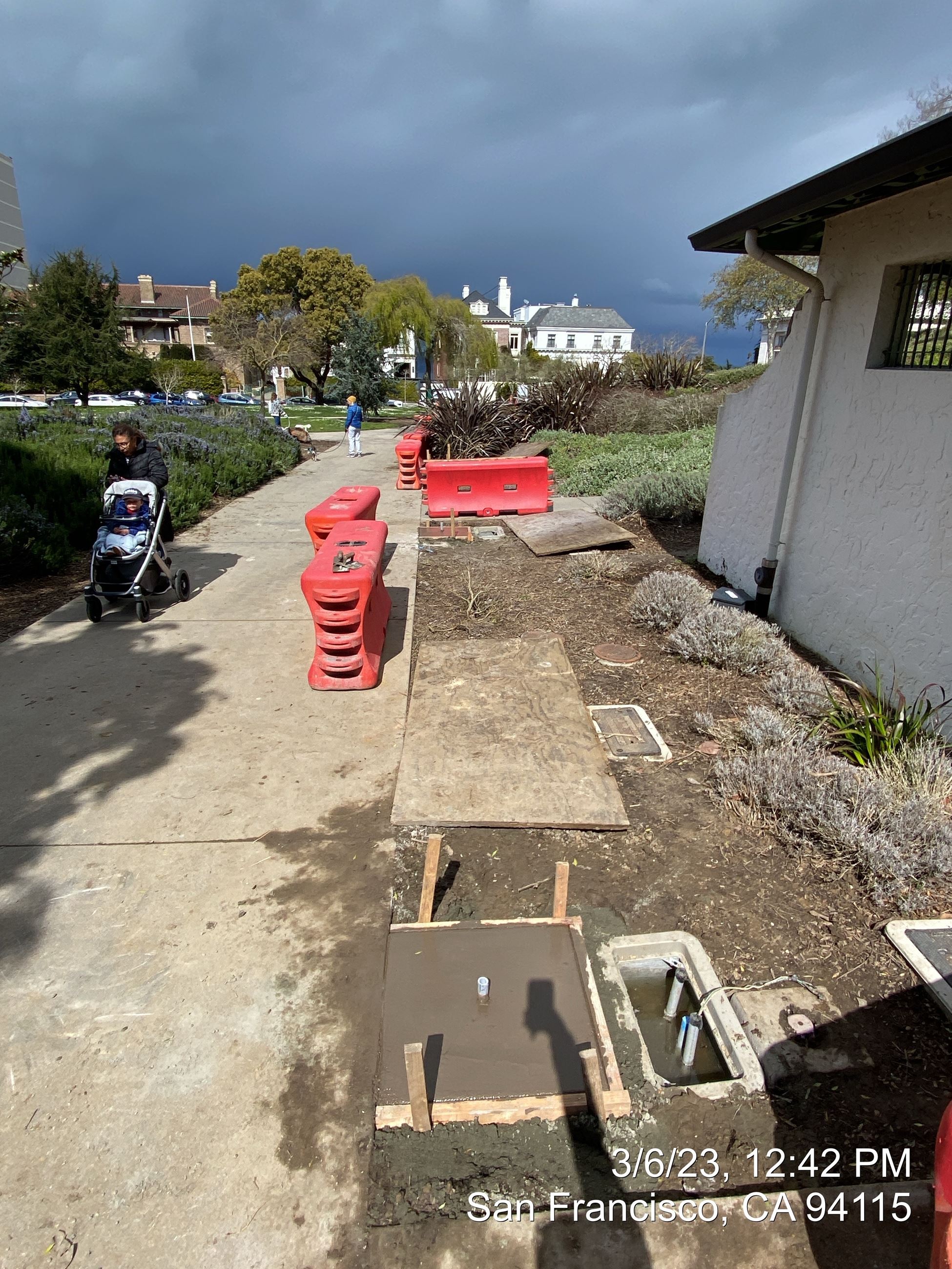 Photo of new light foundation in front of rest room at Lafayette Park