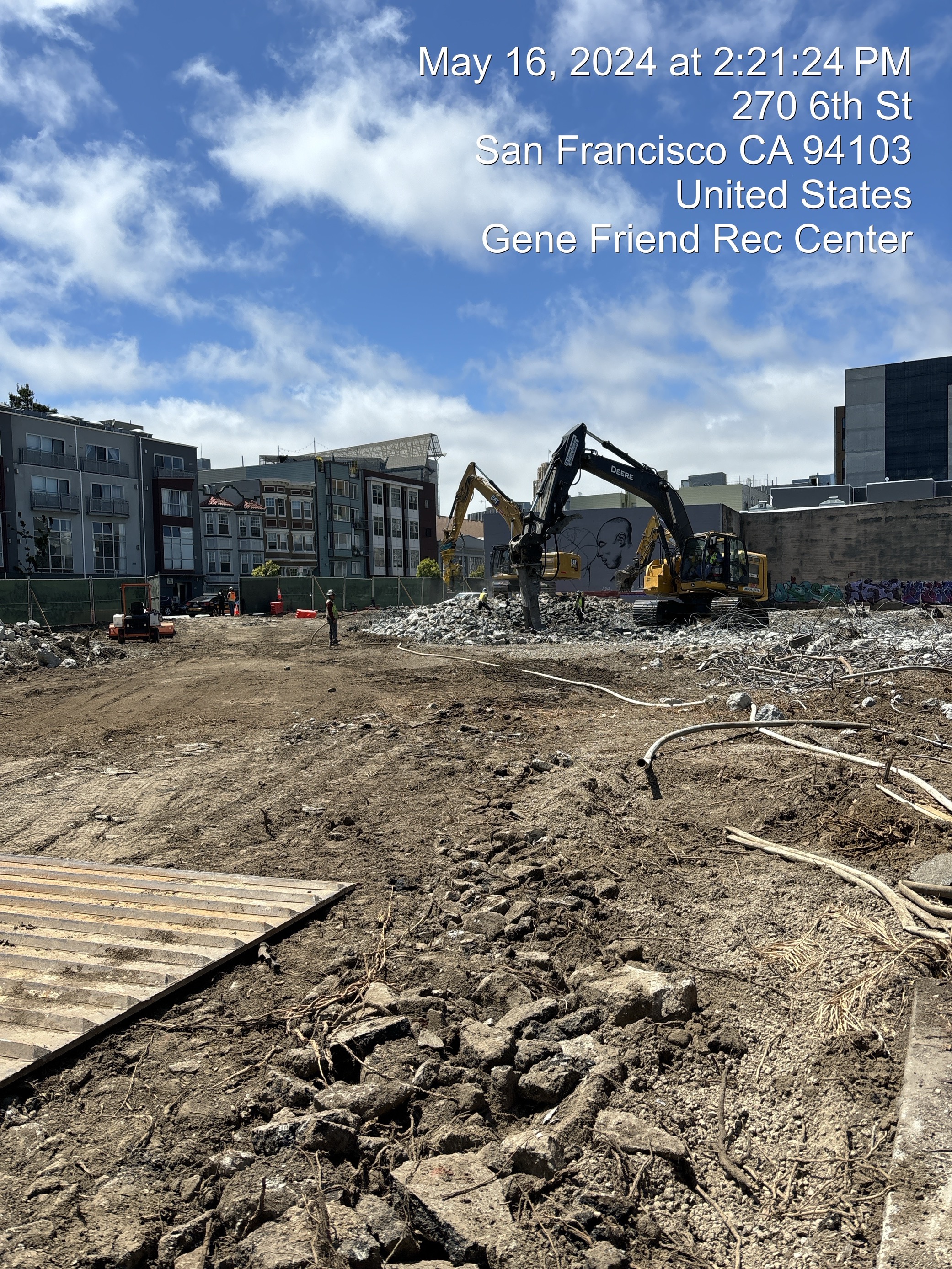 Heavy machinery breaks up concrete