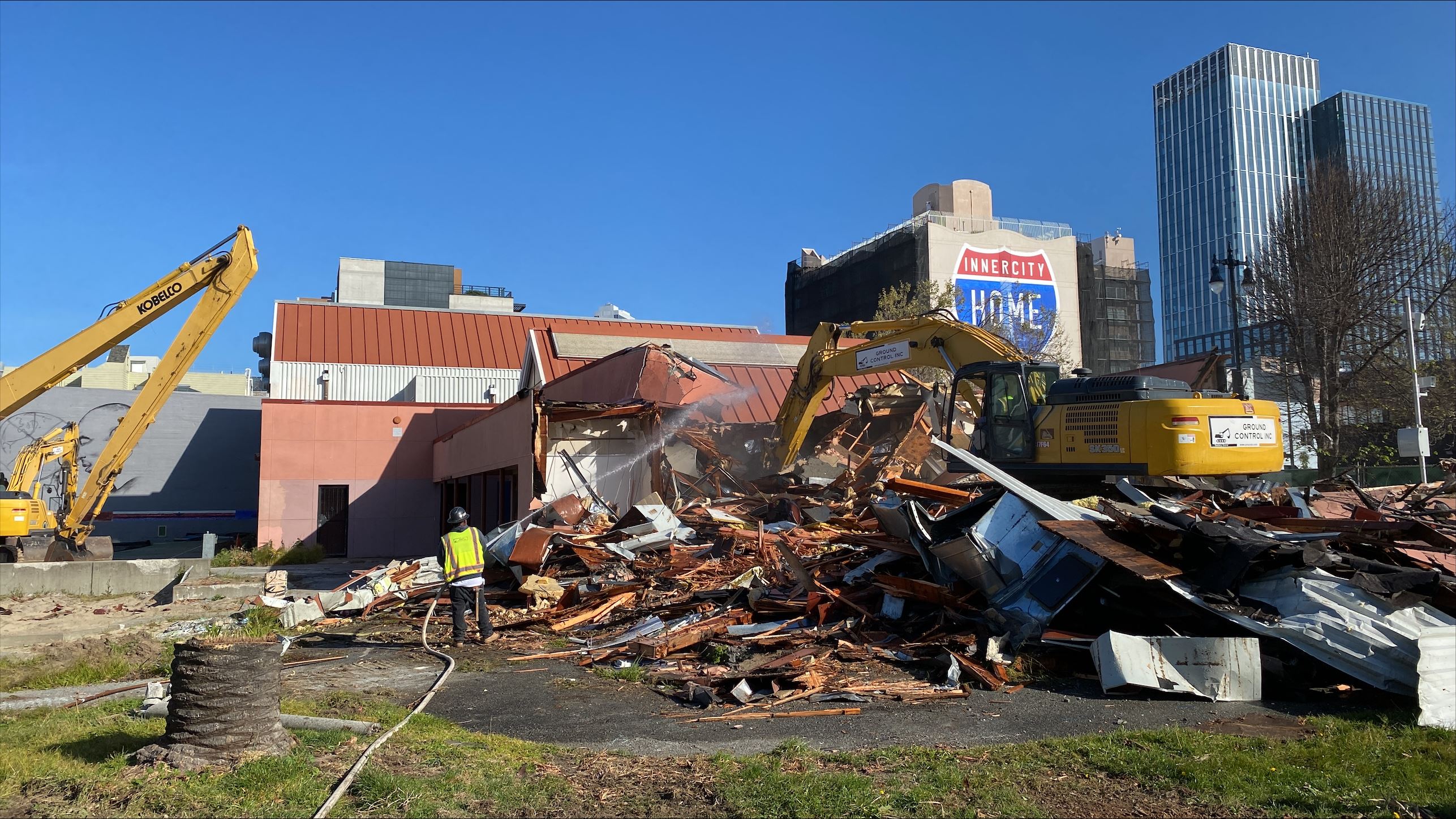 Building being pushed over during demolition