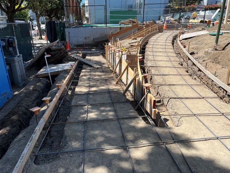 Wood and wire framing of pathways in preparation for concrete pour