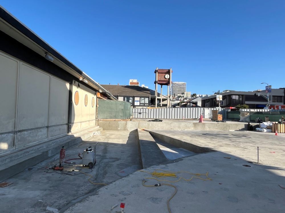 bare concrete facing north inside plaza