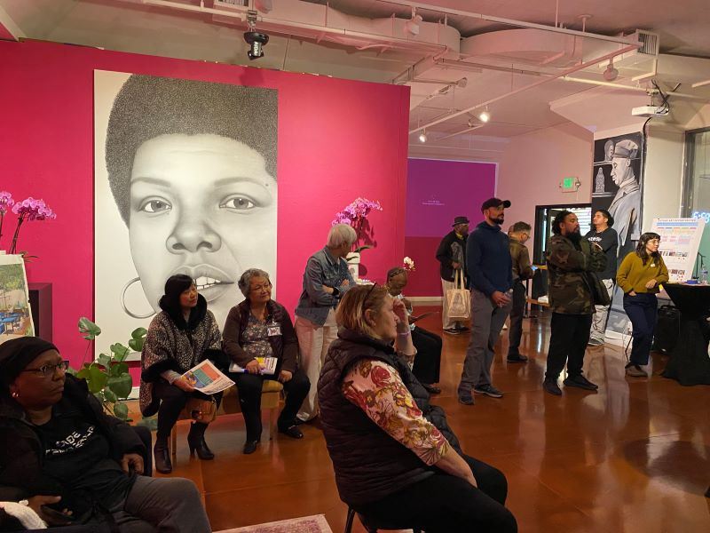 A group of people seated and standing