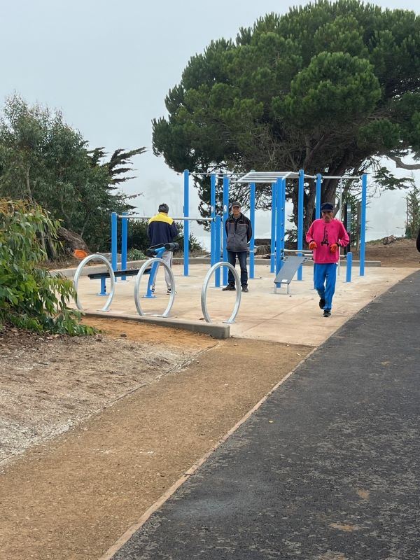 Park goers enjoy fitness equipment