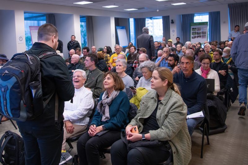 Large gathering of participants at a community meeting