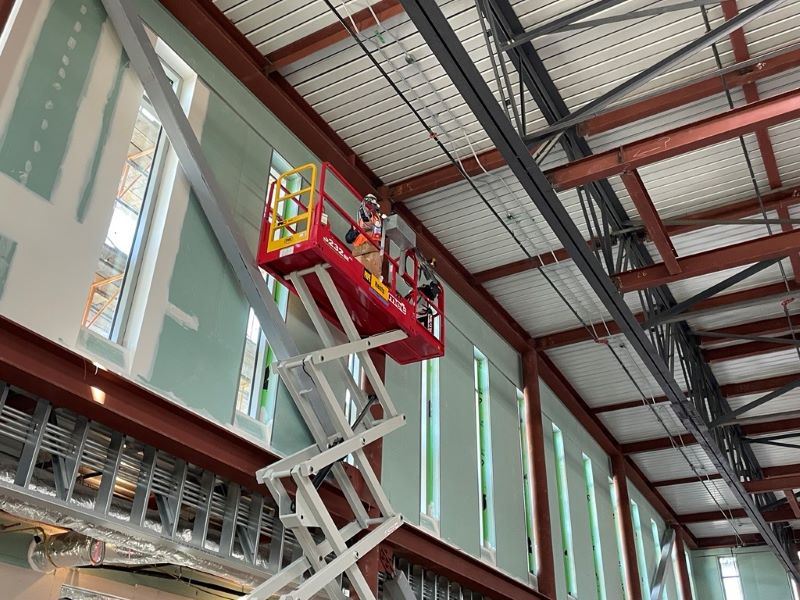 Gene Friend construction December 2025 -Scissor Lift Work in Gymnasium