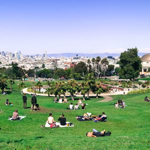 People lounging on a large lawn